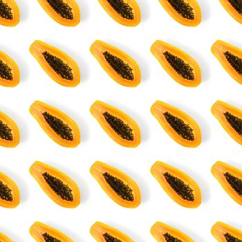 Fresh ripe papaya one direct seamless pattern on white background. Tropical abstract background. Top view. Creative design, minimal flat lay concept. Trend tropical fruit food background pattern