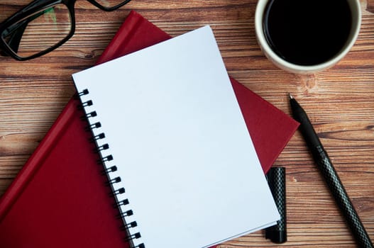 Top view of notepad with customizable space for text or message. Copy space.