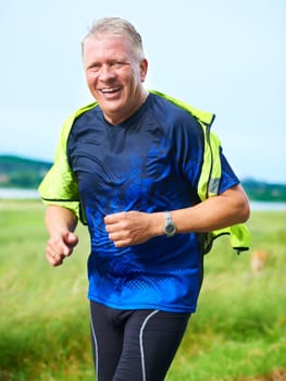 Us seniors need to keep in shape. Portrait of a senior man running outdoors
