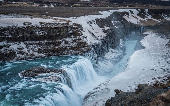 Majestic and dark Gullfoss waterfall in Iceland in a stormy day, moody atmosphere