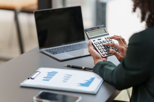 Accountant black woman working on laptop and do document, tax, exchange, accounting and Financial advisor concept.