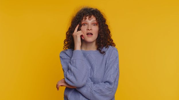 Eureka. Inspired woman pointing finger up with open mouth, having good idea, plan, startup, showing inspiration motivation gesture, problem solution. Young teen girl isolated on yellow background