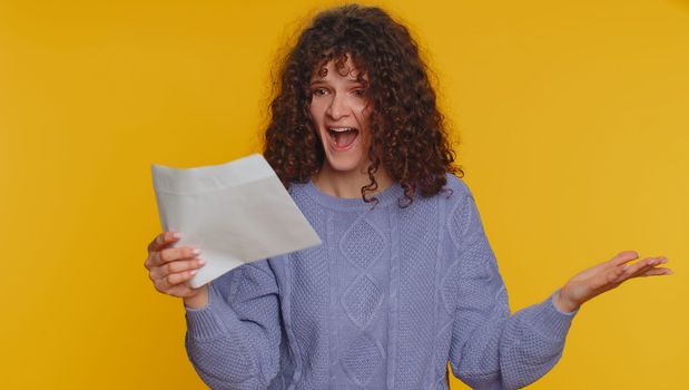 Young student woman open envelope take out letter reads it feel happy. Teen girl career growth advance promotion, bank loan approve, monetary award, long-awaited invitation great news, lottery win