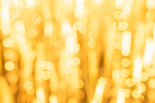 Abstract yellow light twinkled bright background with bokeh defocused lights