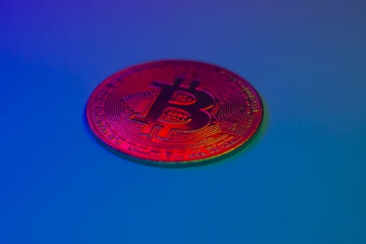 Crypto currency red coin with bitcoin symbol on isolated on black background. Bitcoin Coin on colored background. Bitcoin cryptocurrency. Cryptocurrency Coin Concept. single golden valuable