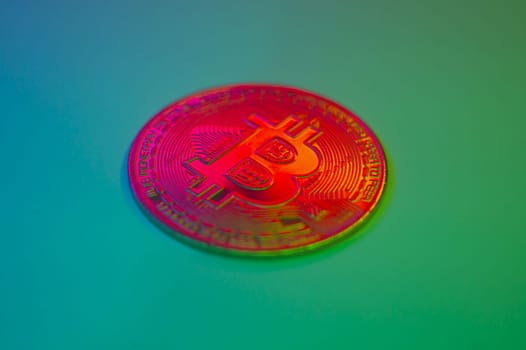 Crypto currency red coin with bitcoin symbol on isolated on black background. Bitcoin Coin on colored background. Bitcoin cryptocurrency. Cryptocurrency Coin Concept. single golden valuable