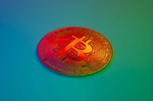 Crypto currency red coin with bitcoin symbol on isolated on black background. Bitcoin Coin on colored background. Bitcoin cryptocurrency. Cryptocurrency Coin Concept. single golden valuable