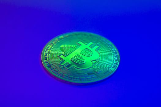 Crypto currency golden-green coin with bitcoin symbol on isolated on black background. Bitcoin Coin on colored background. Bitcoin cryptocurrency. Cryptocurrency Coin Concept. single golden valuable