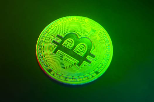 Crypto currency green-golden coin with bitcoin symbol on isolated on black background. Bitcoin Coin on black background. Bitcoin cryptocurrency. Cryptocurrency Coin Concept. single golden valuable