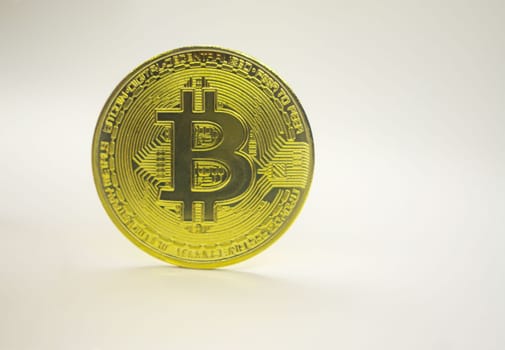 Gold coin Bitcoin on white background. The concept of crypto currency. Blockchain technology. Gold reflect