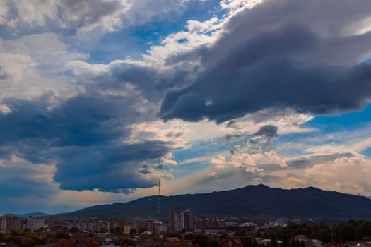 Panorama of mountainous Vladikavkaz in North Ossetia. Dark clouds over the city