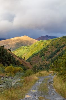 Highlands of North Ossetia. Mountains of the Caucasus. High mountains in the rays of the setting sun