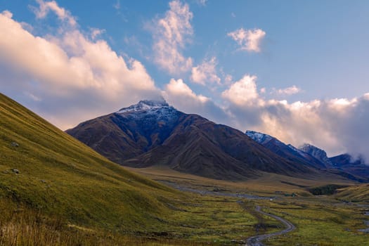 Highlands of North Ossetia. Mountains of the Caucasus. High mountains in the rays of the setting sun
