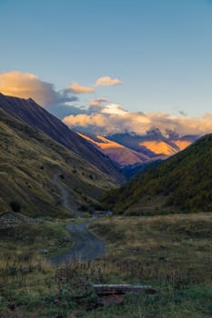 Highlands of North Ossetia. Mountains of the Caucasus. High mountains in the rays of the setting sun