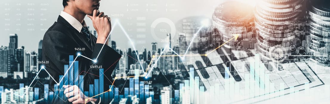 Businessman analyst working with digital finance business data graph showing technology of investment strategy for perceptive financial business decision. Digital economic analysis technology concept.