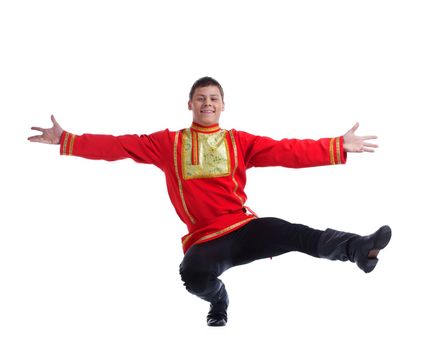 Full length portrait of happy man in russian costume performing dance. Isolated on white