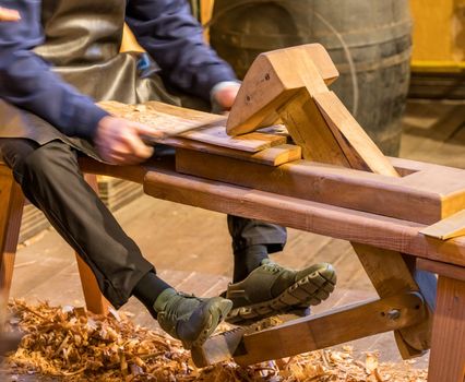 Traditional shaving horse clamp for cooper making a section of barrel