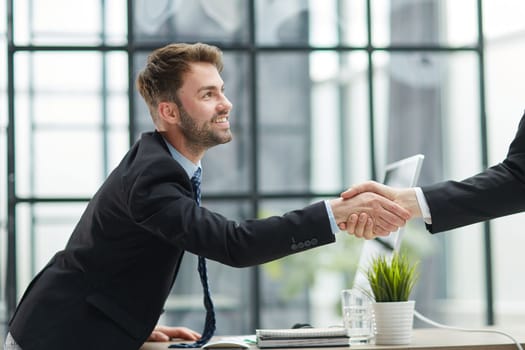 businessman handshake for teamwork of business merger and acquisition