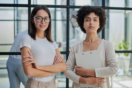 Businesswomen Having Informal Meeting In Modern Office