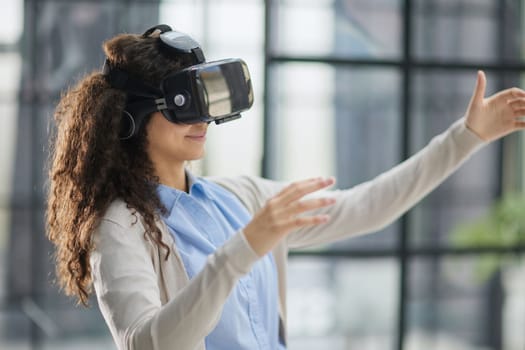 Girl trying to touch objects in virtual reality.