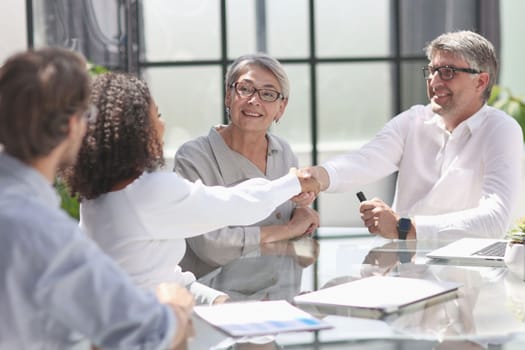 discussion of business people in the office sitting at the table