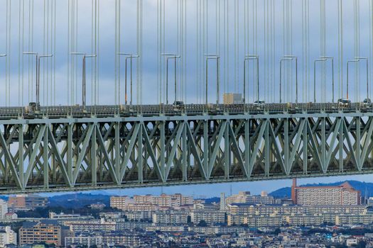 Light Traffic on Bridge Span Over Large Apartment Blocks on Hilly City. High quality photo