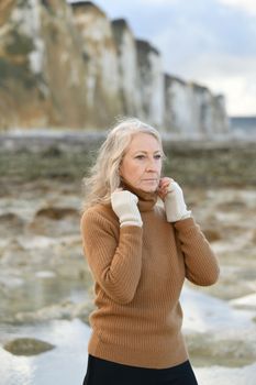 Portrait of a sixty-year-old woman with a grey hair