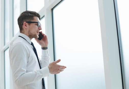 bearded man talking on phone and smiling