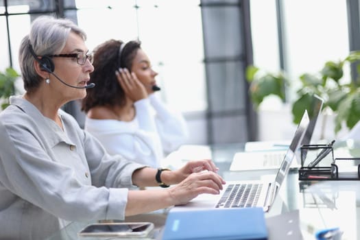 businesswoman working with a headset and accompanied