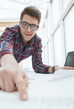 Male Architect working at the modern light office