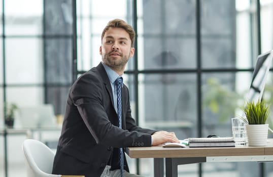 Young businessman working at office