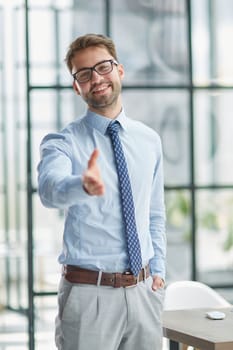 Businessman With Open Hand Ready For Handshake