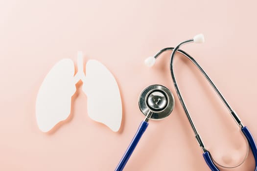 World TB Day. Top view of lungs paper symbol and medical stethoscope on pink background, copy space, lung cancer awareness, concept of world tuberculosis day, banner background, pneumonia