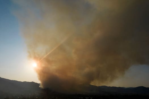 Photographic documentation of a large column of smoke caused by a forest fire in the upper Versilia Tuscany