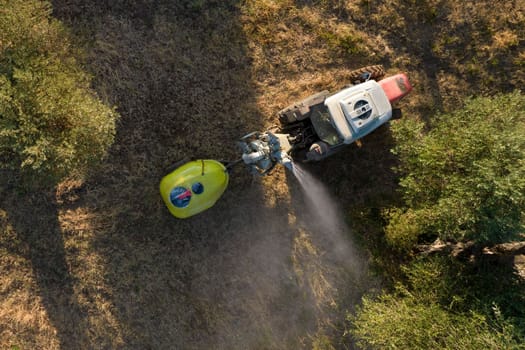 Aerial photographic documentation of the time of the pesticide treatment in an olive plantation