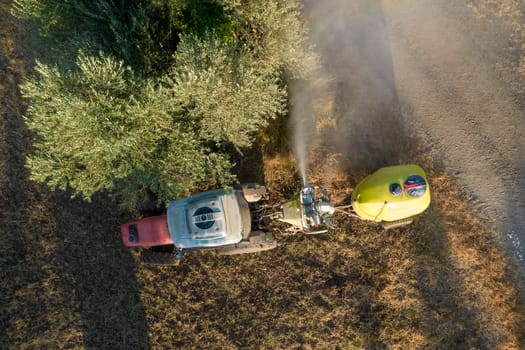 Aerial photographic documentation of the time of the pesticide treatment in an olive plantation