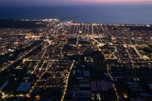 Aerial documentation of the city of Viareggio seen at night 