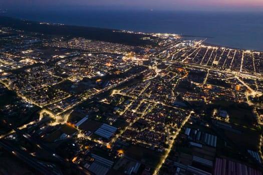 Aerial documentation of the city of Viareggio seen at night 