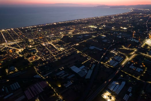 Aerial documentation of the city of Viareggio seen at night 