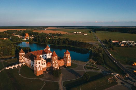 Mir castle with spires near the lake top view in Belarus near the city of Mir.