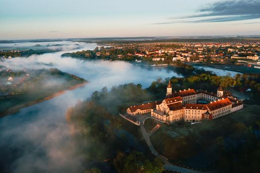 Nesvizh Castle is a residential castle of the Radziwill family in Nesvizh, Belarus, beautiful view in the summer against the blue sky