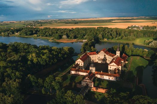 Aerial photo Nesvizh castle in autumn evening, Belarus Minsk, top view