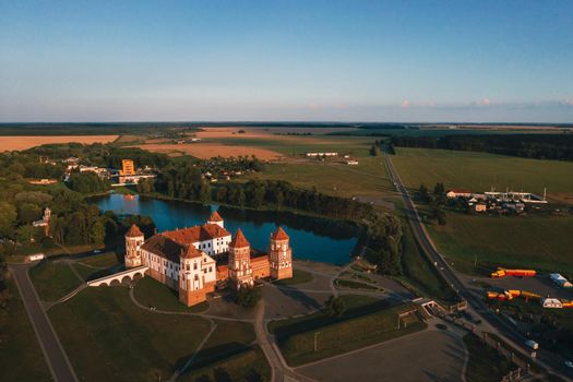 Mir castle with spires near the lake top view in Belarus near the city of Mir.