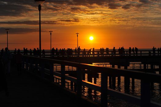 sunset on the pier in Palanga, Baltic sea.