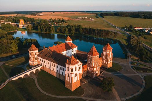 Mir castle with spires near the lake top view in Belarus near the city of Mir.