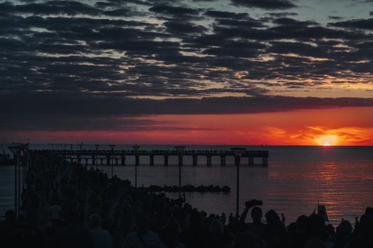 sunset on the pier in Palanga, Baltic sea.