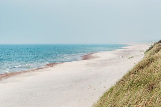 Sandy beach and a blue sea. Baltic sea, Nida, Lithuania