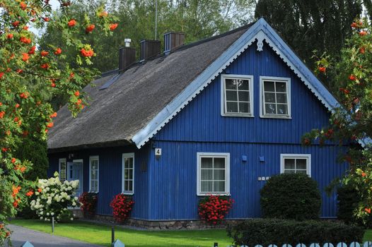 old old wooden house, red, in the European country of Lithuania, in the spa town of Nida, on the Curonian Spit