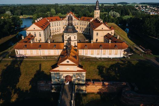 Wedding of newlyweds on the background of the castle in Nesvizh from a height, Minsk region, Belarus.Nesvizh castle, unrecognizable.