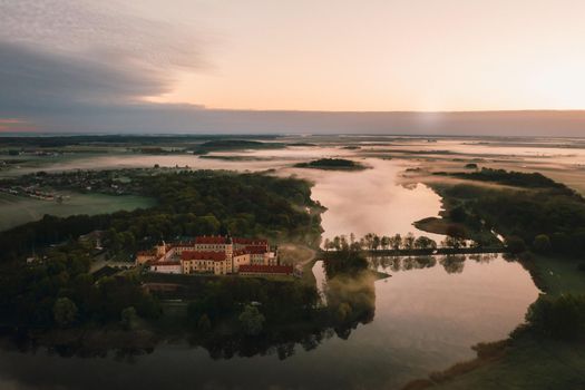 Nesvizh castle is a residential castle of the Radziwill family in Nesvizh, Belarus, with a beautiful view from above at dawn.